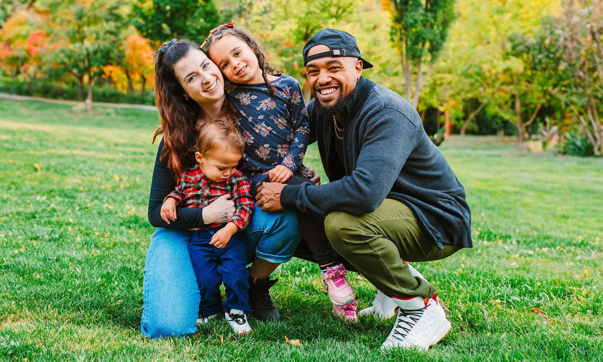 Fallon, Zay, Eko, and Bashaun pose in a park.