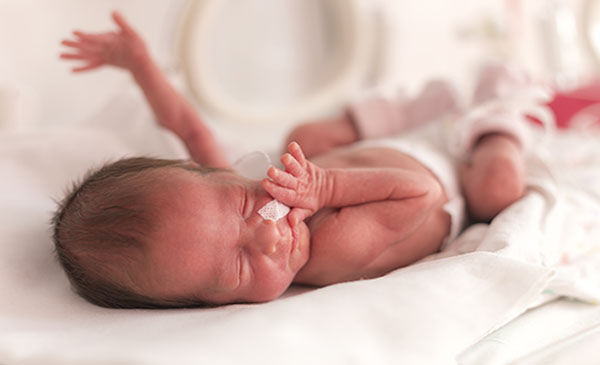 Newborn baby in hospital illustrating umbilical cord testing