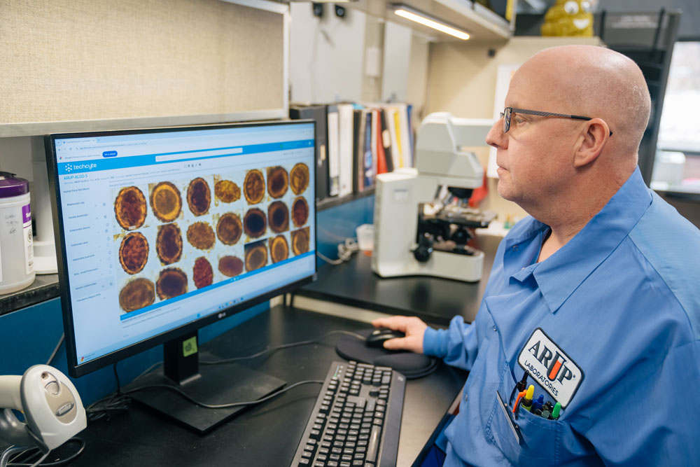 Blaine Mathison sits at a computer