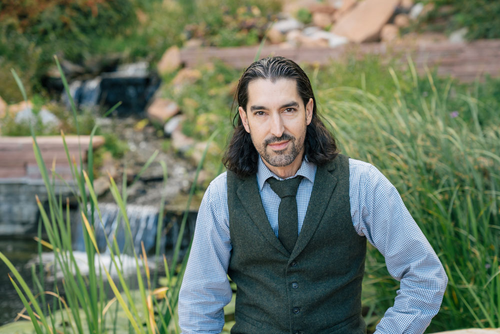 Marc Couturier sitting outdoors