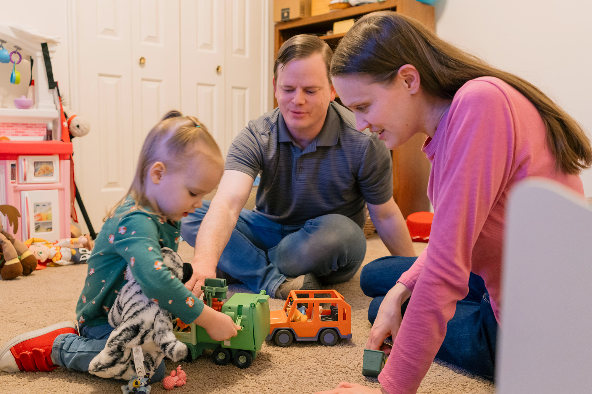 The Jones family playing together on the floor